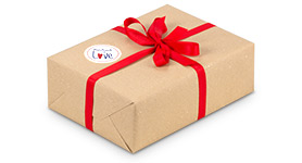 Zu den Geschenkverpackungen & Dekomaterial Geschenkverpackung mit roter Schleife