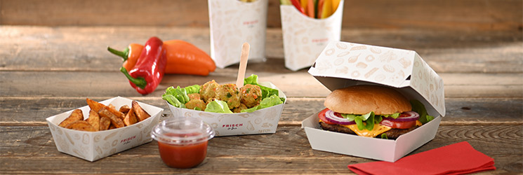 Take-Away Verpackungen von FRISCH & fein auf Holztisch